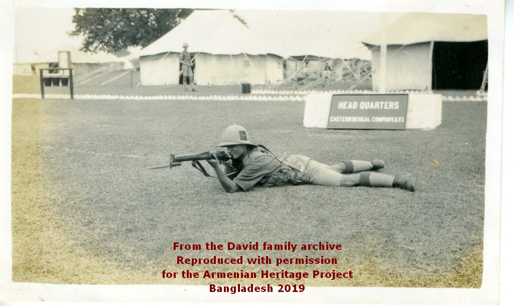 Eastern Bengal Coy Headquarters tent. Ruben David posing with his rifle.